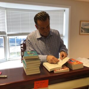 Photo of Michael Marr labeling a book